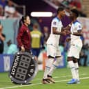 Marcus Rashford and Bukayo Saka of England are substituted during the FIFA World Cup Qatar 2022 Group B match between England and USA at Al Bayt Stadium on November 25, 2022 in Al Khor, Qatar. (Photo by Elsa/Getty Images)