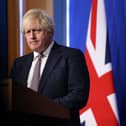Prime Minister Boris Johnson speaks during a press conference after cases of the new Covid-19 variant were confirmed in the United Kingdom on November 27, 2021 in London, England. UK authorities confirmed today that two cases of the new Omicron Covid-19 variant, which had prompted a flurry of travel bans affecting several countries in Southern Africa, were found in the UK. (Photo by Hollie Adams/Getty Images)
