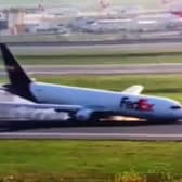 Boeing 767 crashes into runway during emergency landing.