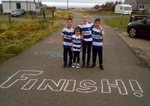 Charlie and Grace Morrison, and Arran and Lewis Goetz celebrate completing ‘A Million Steps for Matthew’, and raising more than £2500 for the Matthew Woodman Foundation.