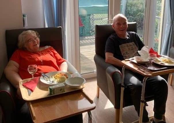 Care home residents Christine MacCuish and Robin Cooke enjoy listening to the concerts at lunchtime.