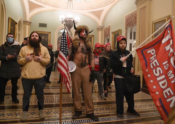 Supporters of US President Donald Trump enter the US Capitol , in Washington. -(Photo by Saul LOEB / AFP) (Photo by SAUL LOEB/AFP via Getty Images)