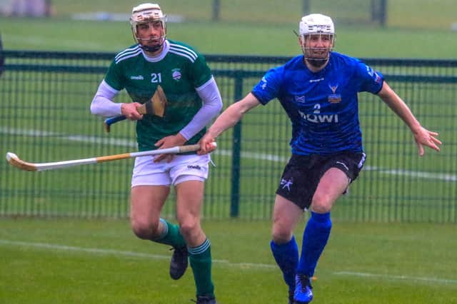 Rory Kennedy (Newtonmore) holds off pressure from Shane Nolan (Kerry) at the 2019 Mowi Shinty/Hurling International (Submitted pic)