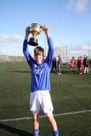Back U15s captain Nathan Rogers lifts the Kemnay Cup