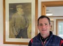 Gary Young in Askernish clubhouse with Old Tom Morris in background