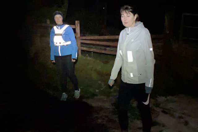Two joggers this time wearing reflective and light-coloured clothing