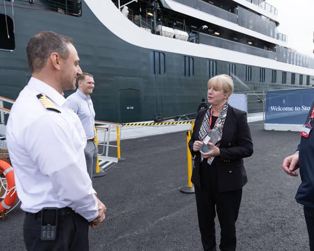 Shona Robison visited Stornoway to officially open the new deep water terminal. She is pictured here with port authority chief executive Alex MacLeod and the crew of a visiting cruise liner. (Pic: Sandie Maciver)