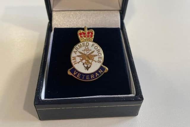 The lapel pin which accompanied the medal.
