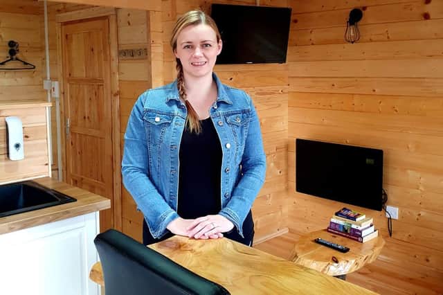Rachel MacKenzie now plans to add a third log cabin