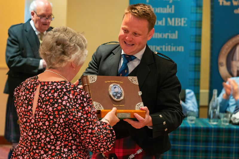 Callum Beaumont receiving his prize from Susan Millar, one of P/M Donald MacLeod’s daughters
