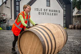 Rebecca Passmore, an employee at the distillery, shows that it's all hands on ahead of the big September launch.