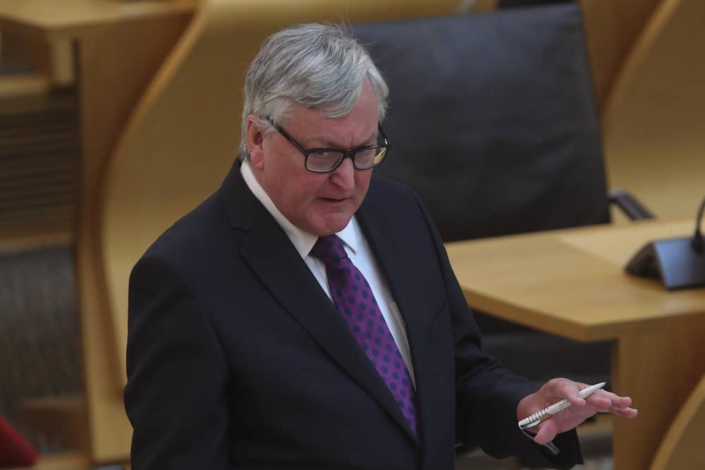 EDINBURGH, SCOTLAND - JUNE 10: Fergus Ewing MSP, Cabinet Secretary for Rural Economy, gives a ministerial statement on tourism during the coronavirus crisis today at the Covid-19 social distancing Scottish Parliament, Holyrood on June 10, 2020 in Edinburgh, Scotland. (Photo by Fraser Bremner-Pool/Getty Images) : -