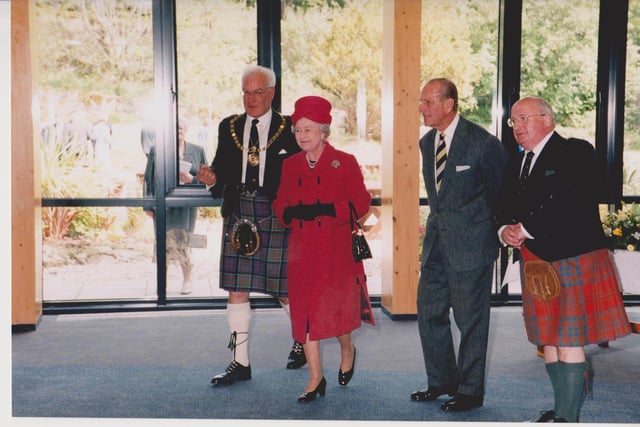 The Convener of Comhairle nan Eilean Siar, Alex Macdonald, and Sandy Matheson with the Queen and Duke at Lews Castle College during the 2002 visit