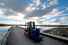 Forklift in operation outside the factory, located on Callanish pier