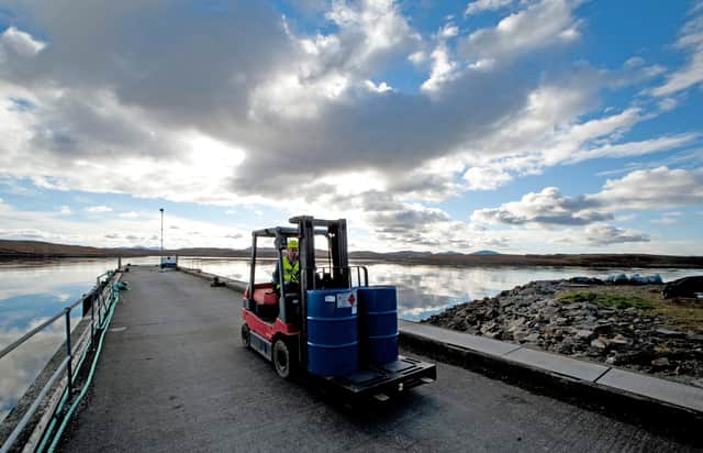Forklift in operation outside the factory, located on Callanish pier