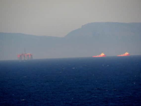 The "Northern Producer" oilrig just off the Butt of Lewis on a hazy morning. The Sutherland hills form an impressive backdrop.