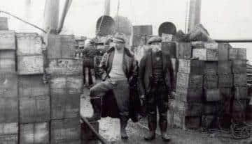 The second official salvage crew removing some of the cases of whisky