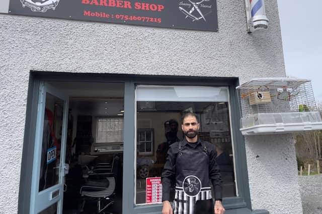 Ousama has now estblished a barber's business in the town. Pic Ronan Wilson