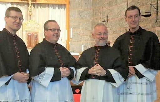 On the right of picture with fellow island priests John Paul Mackinnon and Michael Hutson at their appointment as canons.