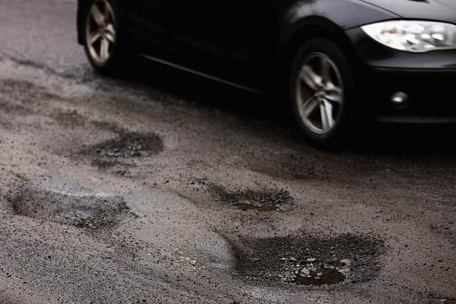 Councils are facing huge gaps in funding for key services, such as roads maintenance.  (Photo by Jeff J Mitchell/Getty Images)