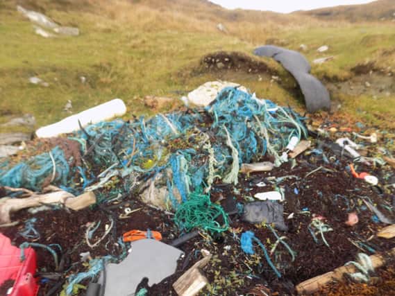 An example of fish farm waste left abandoned on the shoreline