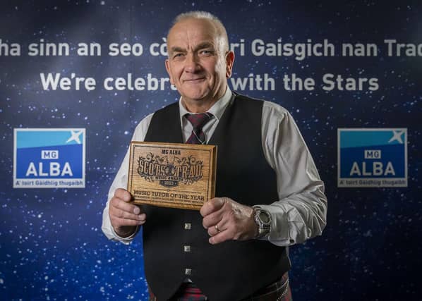 Domhnall Bàn MacDonald accepts award for Music Tutor of the Year