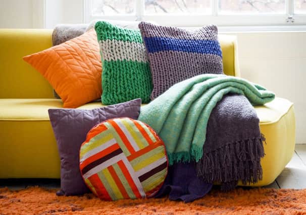 Cushions from £20, Clayton throw £110; Sedgewick sofa, £1,200, Habitat. Photo: PA Photo
