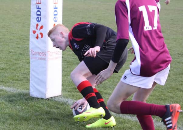 Lewis Stewart scores the fifth try for Biggar Rugby Club's  U15 team which won the Edinburgh District Plate Final in April 2015 (Pic by Nigel Pacey)