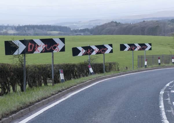 Three in a row...defaced chevrons on bend on the A70