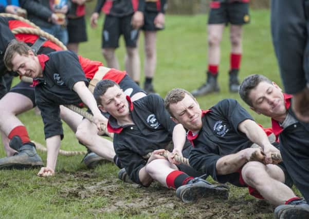 Heave...Biggar Red Team pull their way to victory in the Lanarkshire contest held in the mud of the rugby field on Sunday evening (Picture Sarah Peters)