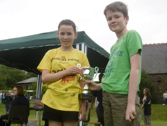 Penninghame School sports day winners  House Captain, Eilidh Sneddon & Vice Captain, Daniel Jones from the winning team (Cree) with the sports cup.