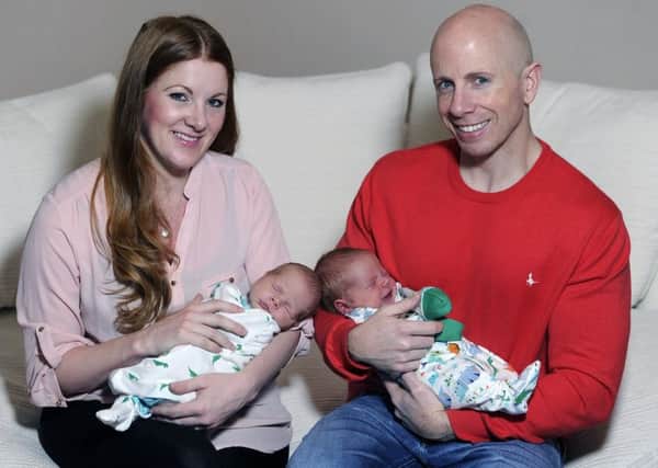 Alanna and Paul Merrie with newborn twins Kaius and Troy. Picture: Neil Hanna