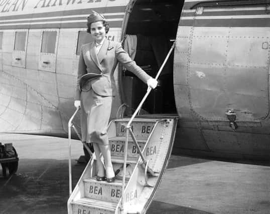 BEA air hostess Jill Morgan prepares to welcome passengers to a flight departing from Turnhouse in June 1955. Picture: TSPL