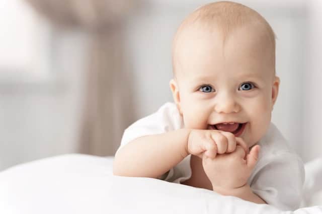 A smiling baby is among the ten things that make Britons happiest