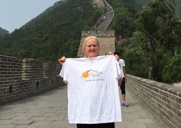 Claudine, with a Leanne Fund  t-shirt, at the Great Wall of China.