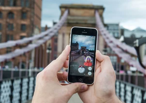 22/07/16 . GLASGOW.  Glasgow, Upper Harbour, South Portland Street Suspension Footbridge.
Pokemon Go game players congregate at the bridge which has become a hotspot. Players are travelling long distances to catch em all. For SoS story by Danni Garavelli.