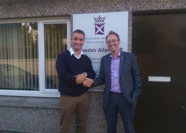 MP Angus MacNeil and MSP Alasdair Allan outside the new office