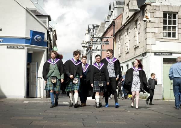 The successful graduates making their way to the ceremony.