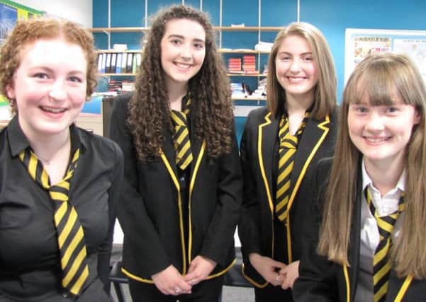 The photo shows the four pupils who achieved five A grades at Higher.
