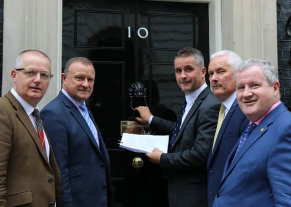 Pictured handing in the petition are: Brendan OHara MP, Argyll and Bute; Drew Hendry MP, Inverness, Nairn, Badenoch and Strathspey; Angus MacNeil MP, Na h-Eileanan an Iar; Paul Monaghan MP, Caithness, Sutherland and Easter Ross; and Ian Blackford MP, Ross, Skye and Lochaber.