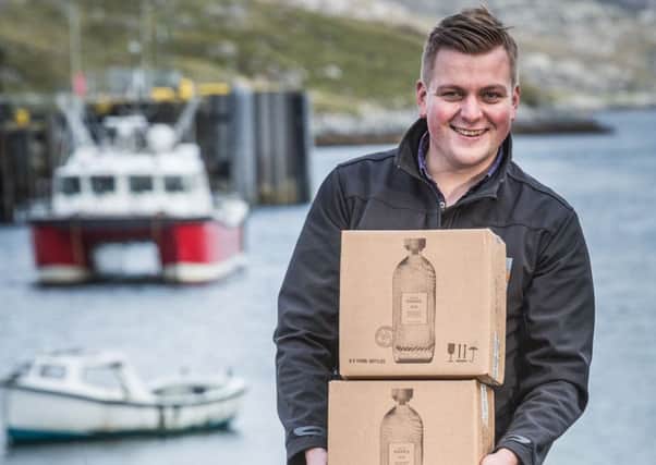 Alexander Macleod loading Harris Gin for delivery.