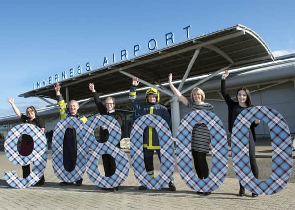 Staff from Inverness Airport celebrate increased passenger numbers. Picture by Trevor Martin.