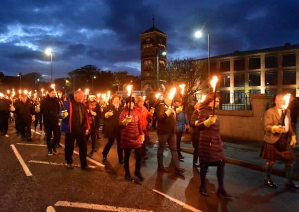 The Lewis Pipe Band leads the Torchlight Procession through the streets of Stornoway to the Lewis Sports Centre, marking the opening of this years Royal National Mod in the Western Isles.  Pictures courtesy of An Comunn Gaidhealach