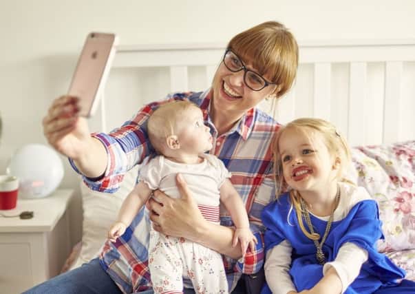 One of the ideas on the play list is for parents and carers to smile for a selfie with their children.
