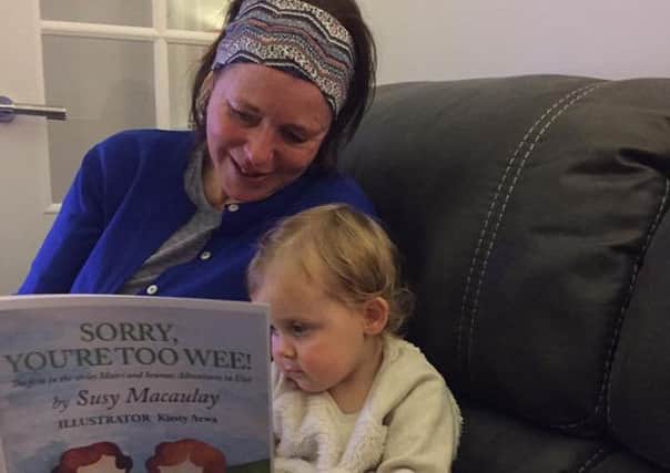 Susy Macaulay with a young reader of her book. Photo by Cathie Ann MacSween.