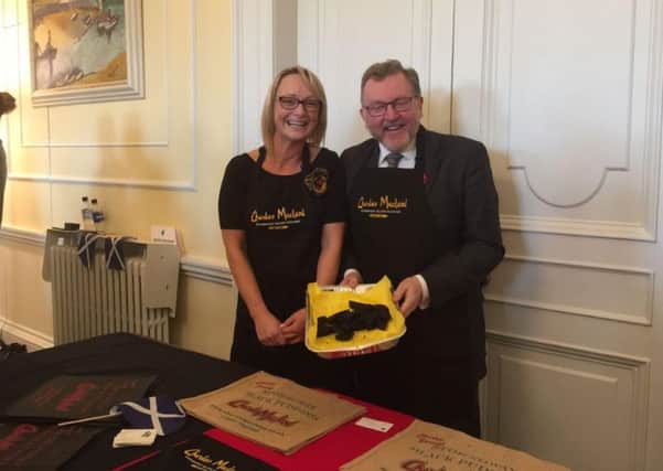 Pictured is Shona Macleod with Secretary of State for Scotland David Mundell MP, helping out on the Charles Macleod stand at the Taste of Scotland showcase.