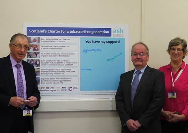 Tobacco-free Charter: Neil Galbraith, NHSWI Chair, Murdo MacMillan, NHSWI Non-Executive Director, and Dr. Maggie Watts, NHSWI Director of Public Health.