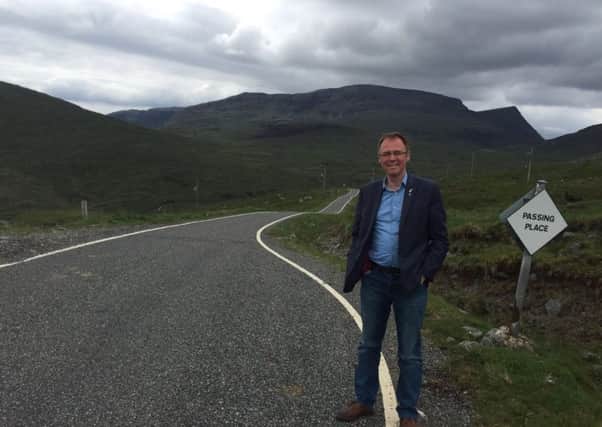 Alasdair Allan on the road to Rhenigidale, Isle of Harris. European funding allowed the village to be connected to the rest of the island in 1989.