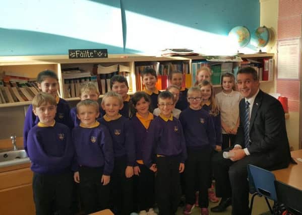 Angus with pupils at Laxdale School where he fielded questions about world affairs.