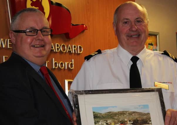Pictured are Donald MacKillop presenting Finlay Smith with a picture of the old MV Hebrides  the second David MacBrayne ship to bear the name; the first was a ship built for McCallum shipping in 1898 and was later taken over by David MacBrayne.
